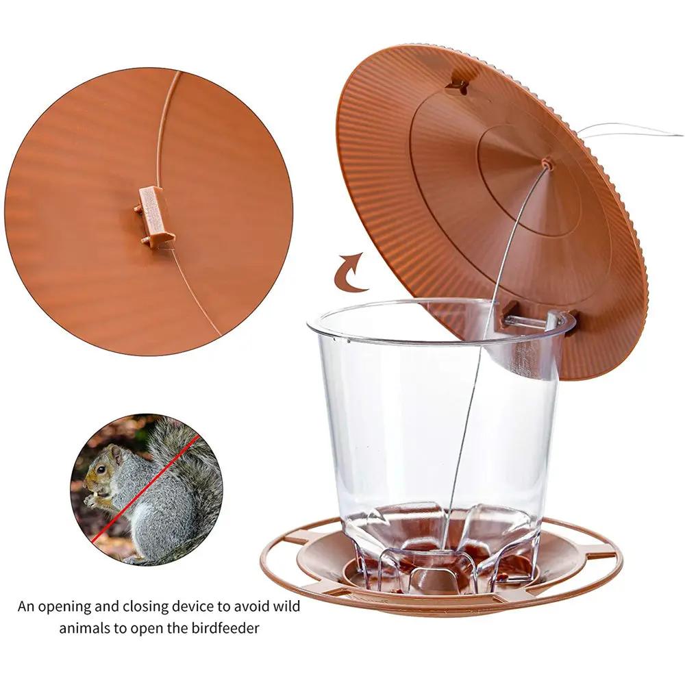 Bird feeder Simples Market; brown lid, clear plastic hopper, hanging design