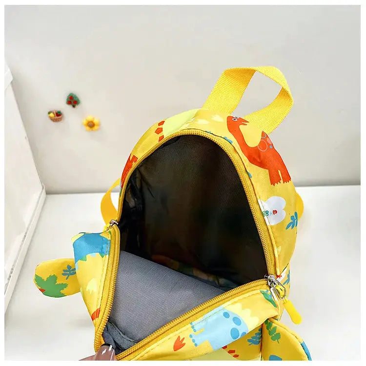 Kids dinosaur backpack by Simples Market, yellow cartoon print, anti-lost design for boys and girls.