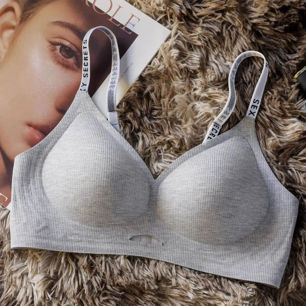 Grey seamless wireless bra with ribbed knit fabric and branded straps
