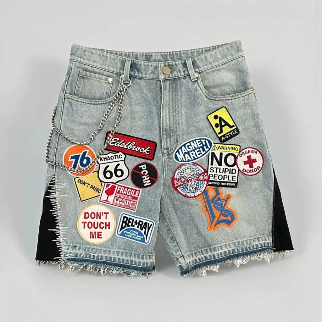 Denim shorts with colorful patchwork graphics and a chain, light blue distressed streetwear style, Simples Market