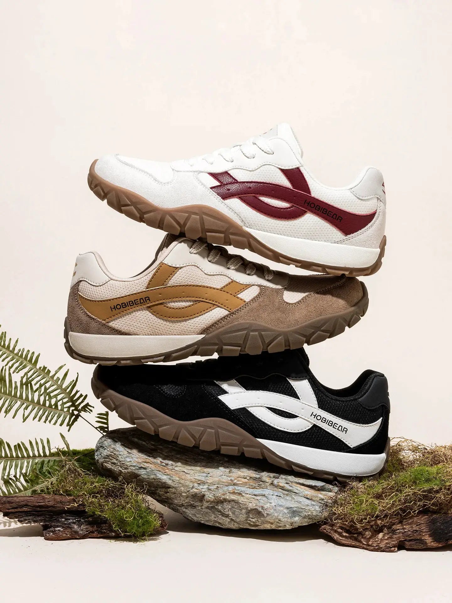 HOBIBEAR unisex wide-width sneakers, three pairs stacked—white with red accents, tan, and black.