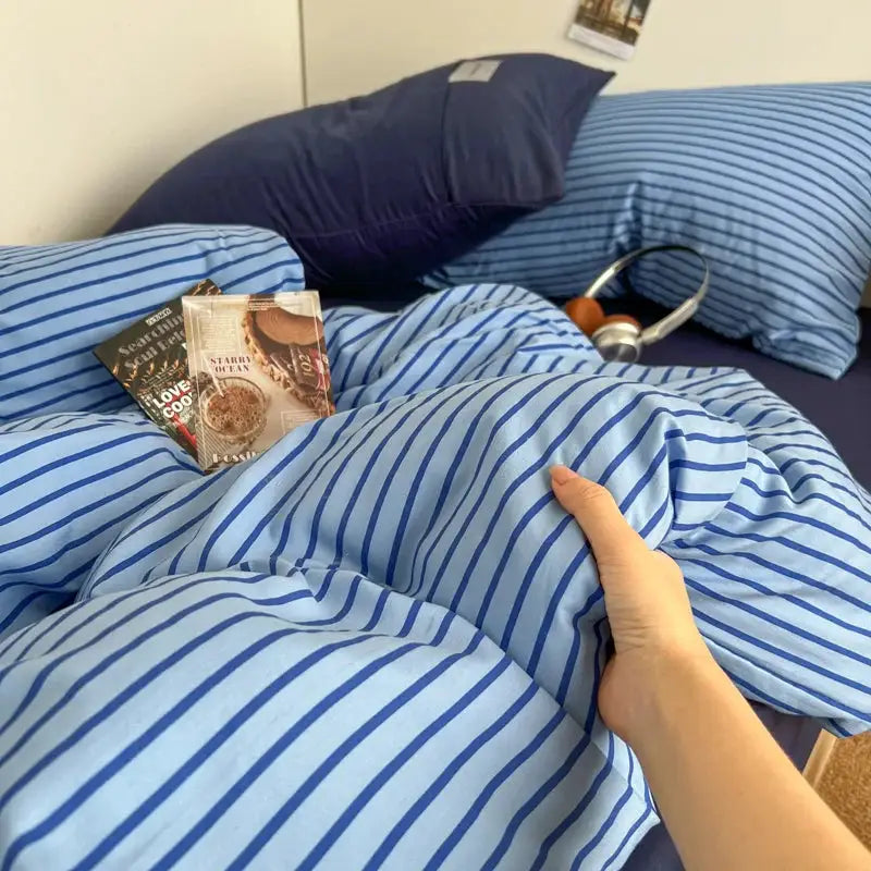 Bedding set Simples Market INS blue stripe duvet cover with pillowcases and bedsheet on bed