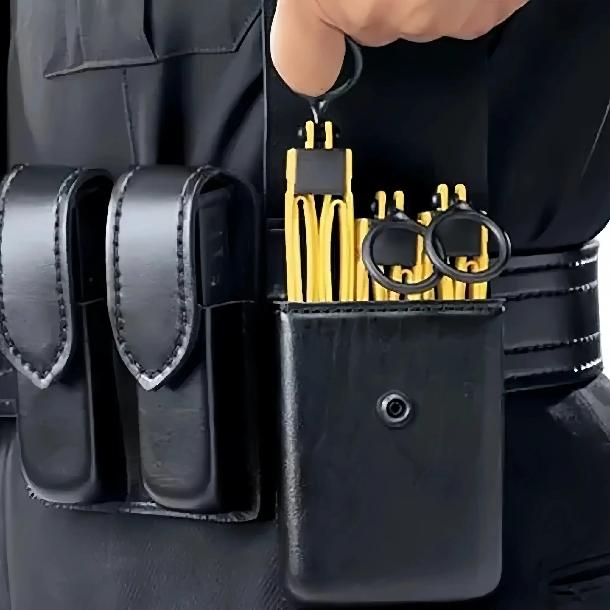 Tactical plastic restraint handcuffs, yellow with black loops, on display rack