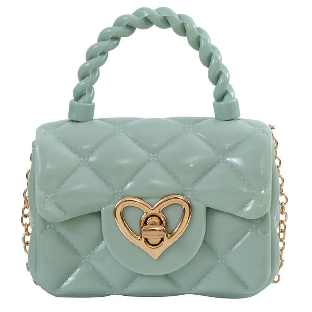 Kids PU leather quilted crossbody bag in pastel green with heart-shaped gold clasp and chain strap
