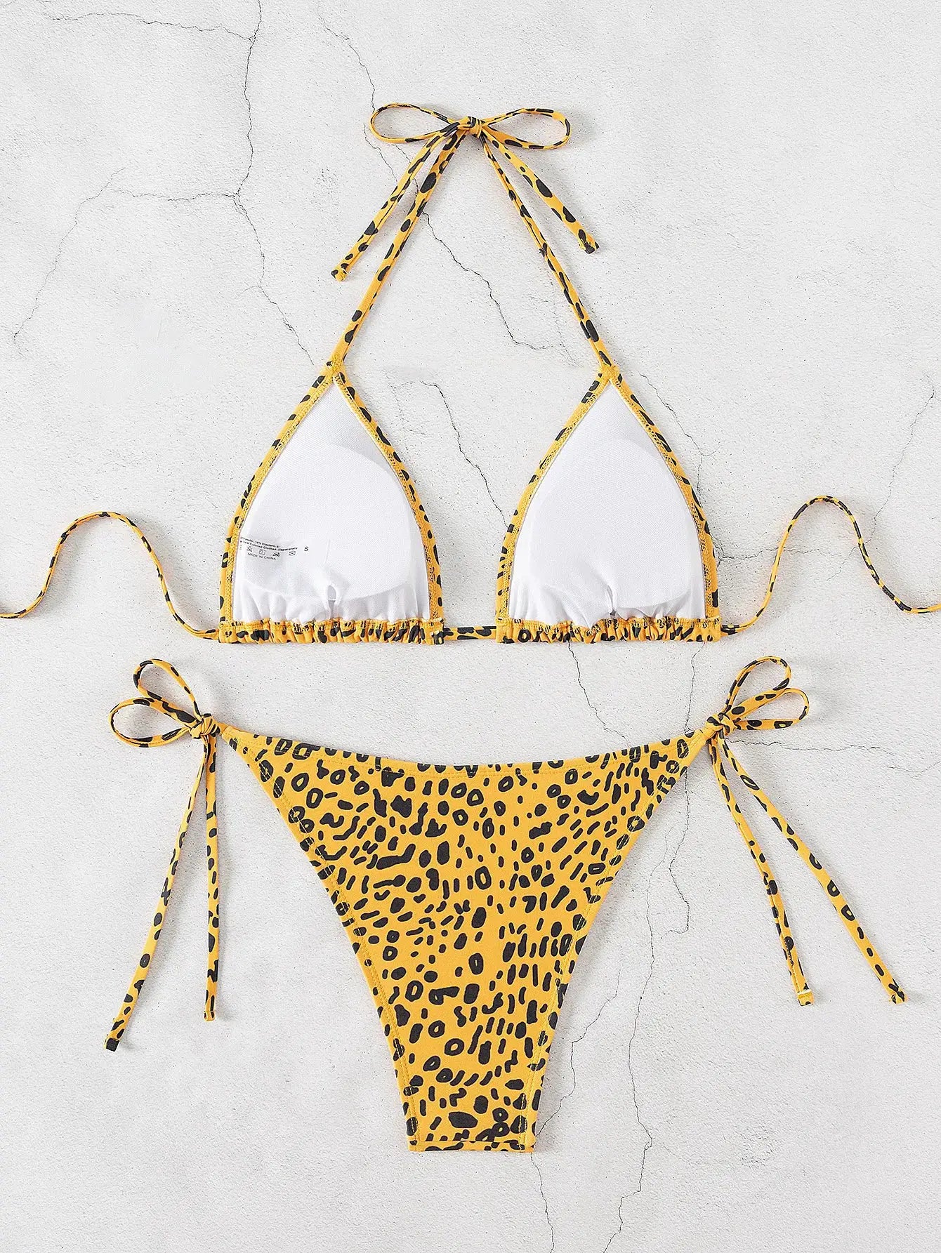 Two-piece triangle bikini set in yellow leopard print with white cup panels and tie-back top, Brazilian bottom