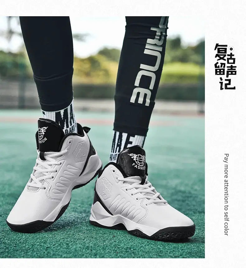 Pair of white sneakers with black accents and tongue logo on a green court.