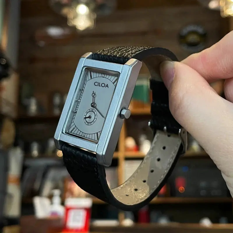 CILOA square quartz watch with silver case and black leather strap