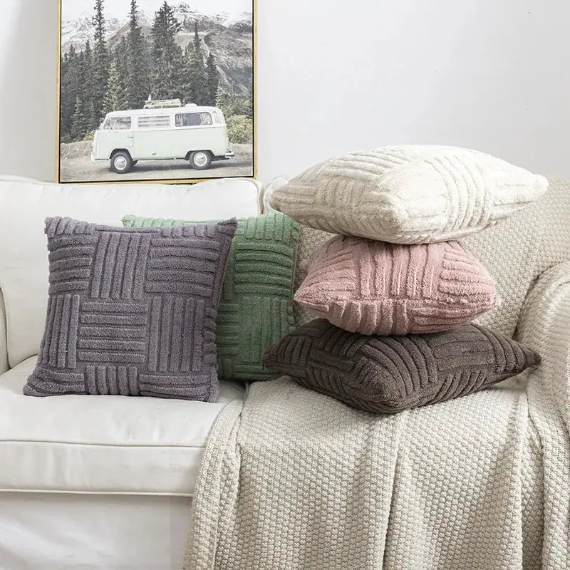 Boho faux-fur throw pillow covers, five colors (cream, gray, green, pink, brown) on a white sofa.