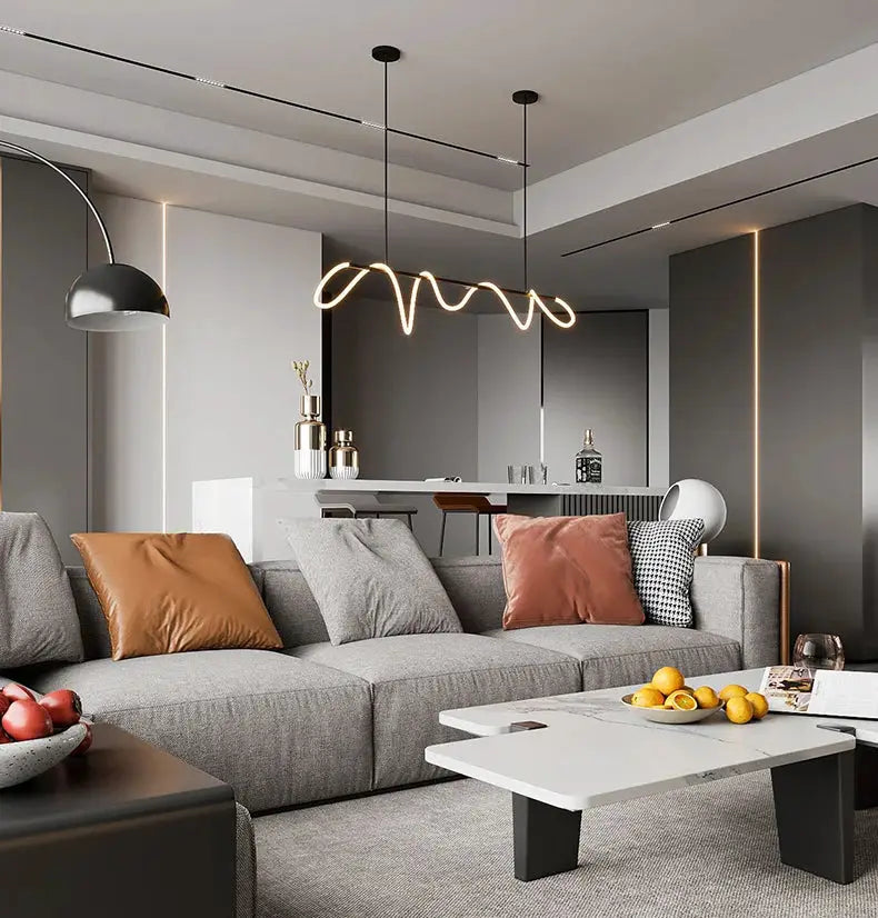 Nordic-style pendant light with a wavy warm-white LED glow over a modern living-dining space.