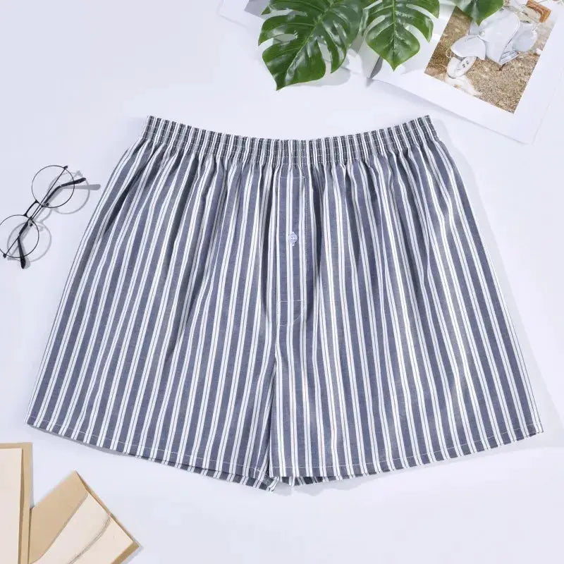 Men's striped cotton boxers shorts with elastic waistband, navy and white vertical stripes.