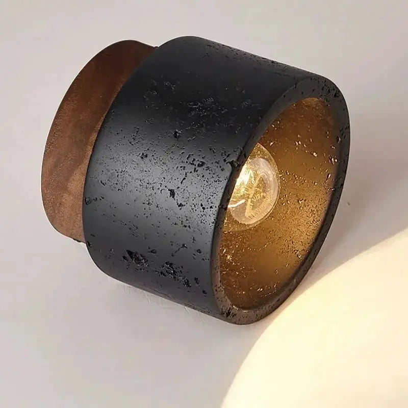 Wabi-sabi black ceiling lamp with textured cylindrical shade, bronze interior and copper backplate