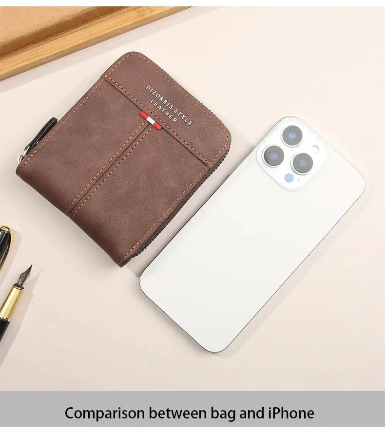 Brown leather wallet Simples Market with zipper, compact 3-fold design, shown beside white iPhone