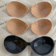 Set of 3 women's strapless adhesive bras in nude and black silicone, seamless push-up bralettes