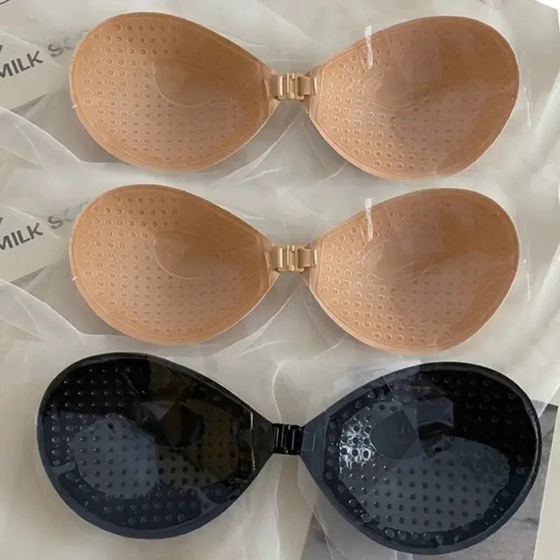 Set of 3 women's strapless adhesive bras in nude and black silicone, seamless push-up bralettes
