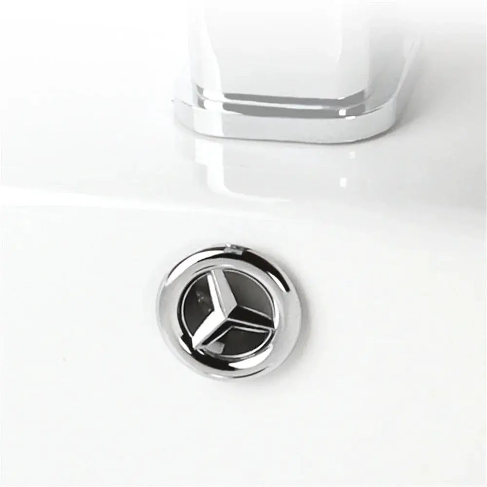 Chrome round sink overflow cover with a 3-spoke inner design
