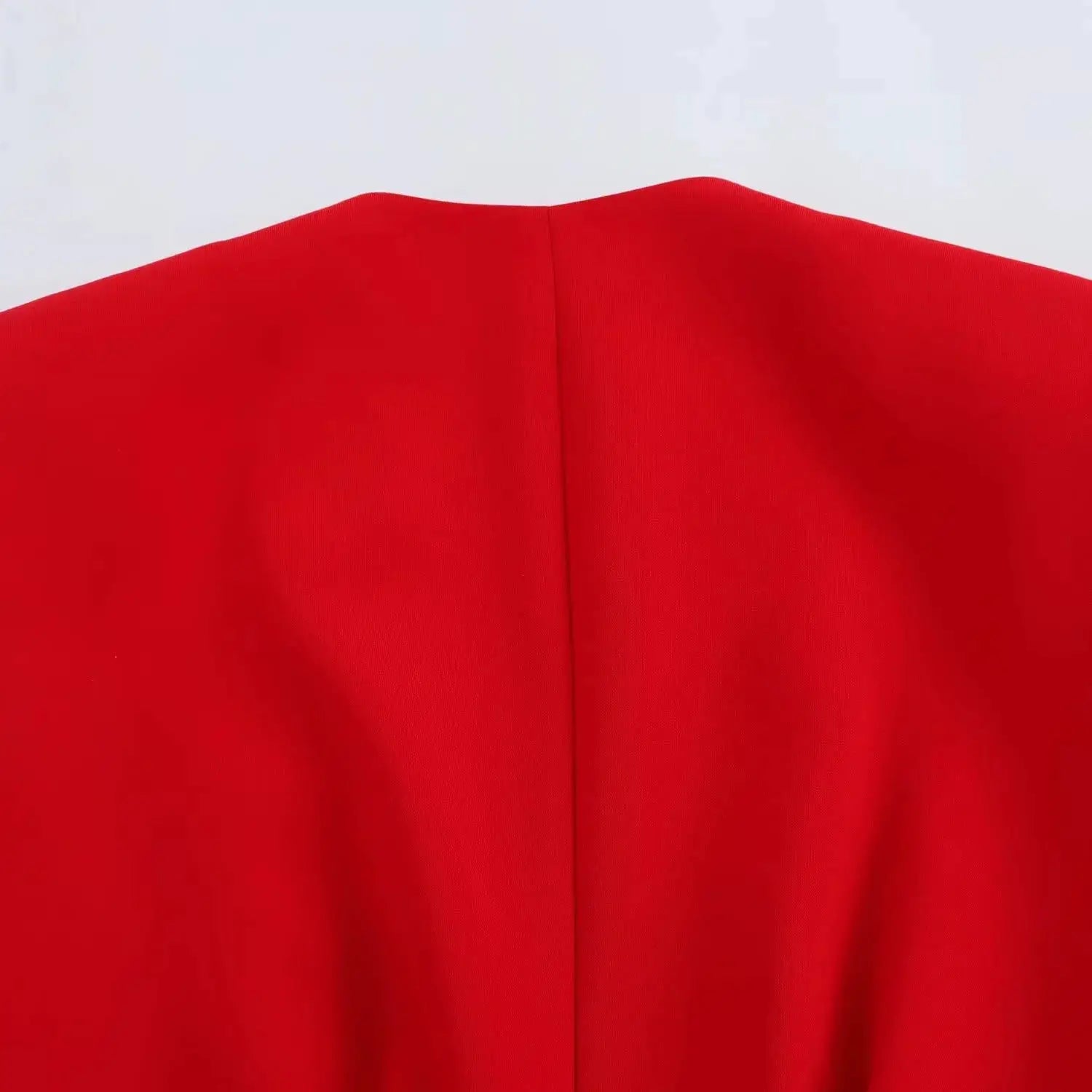 KONDALA red vest blazer fabric close-up with center seam