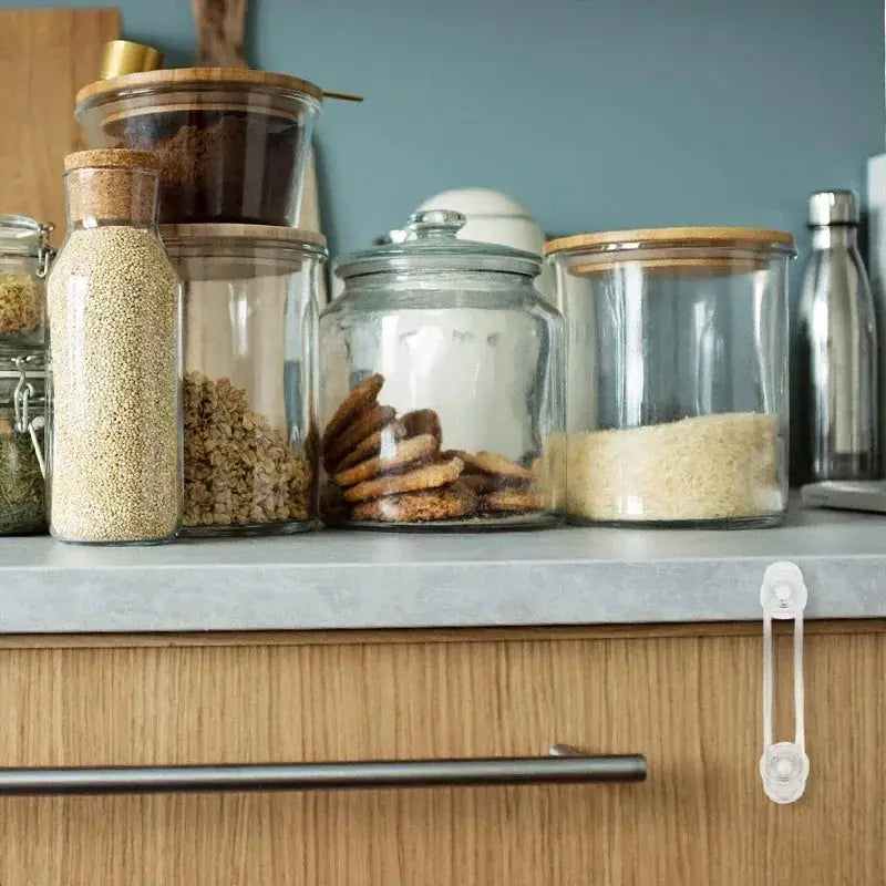 Multi-functional child safety lock with a transparent soft strap for drawers and refrigerators