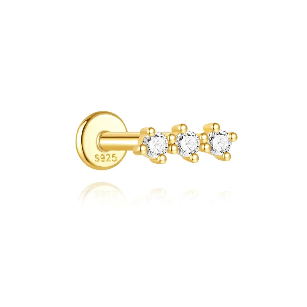 Gold-tone helix piercing ear stud with three clear zircon stones on a bar