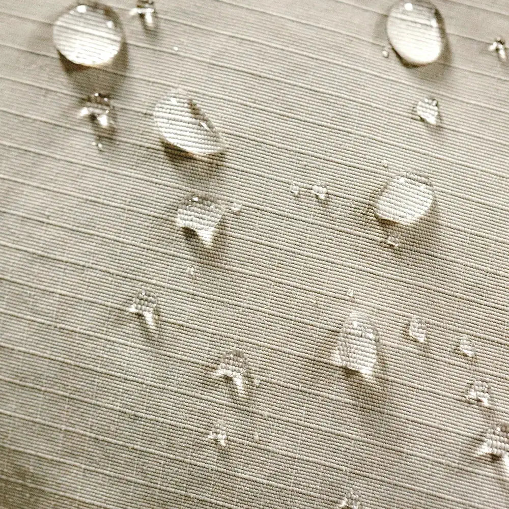 Maden Winter Down Jacket fabric close-up in beige waterproof material with water beads