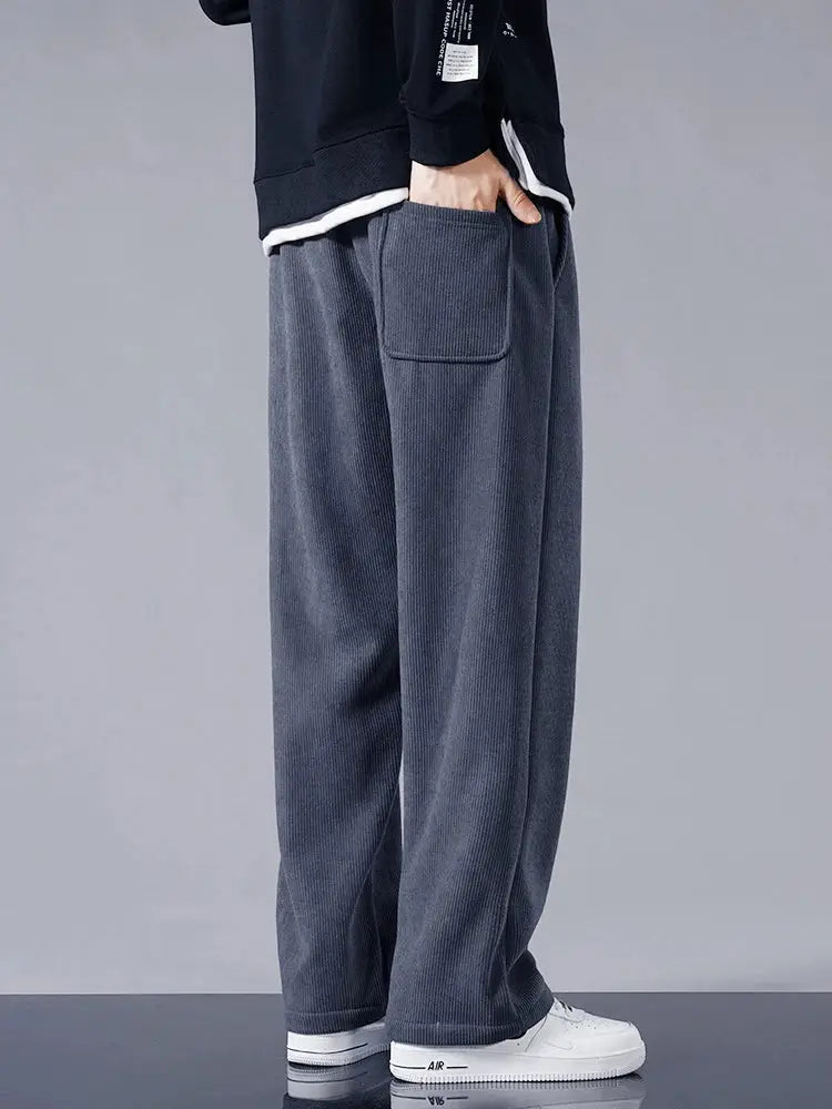 Men's corduroy fleece-lined track pants, charcoal gray, loose straight fit with side patch pocket.