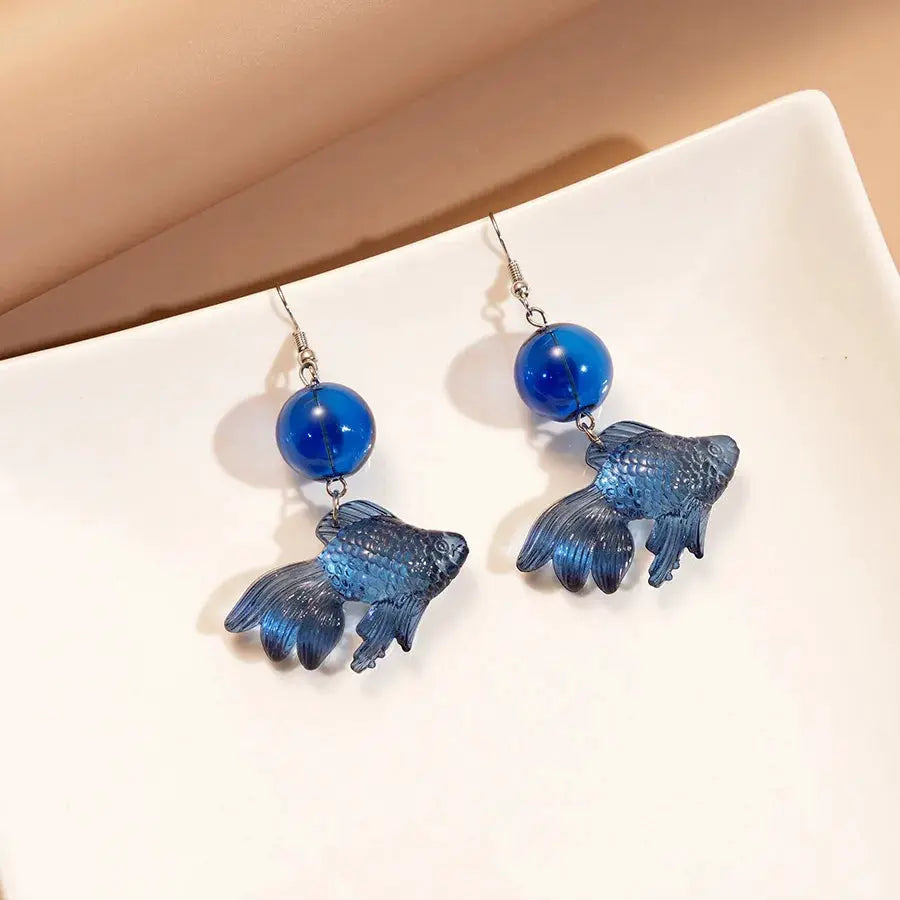 Goldfish drop earrings with a transparent blue koi pendant and blue bead