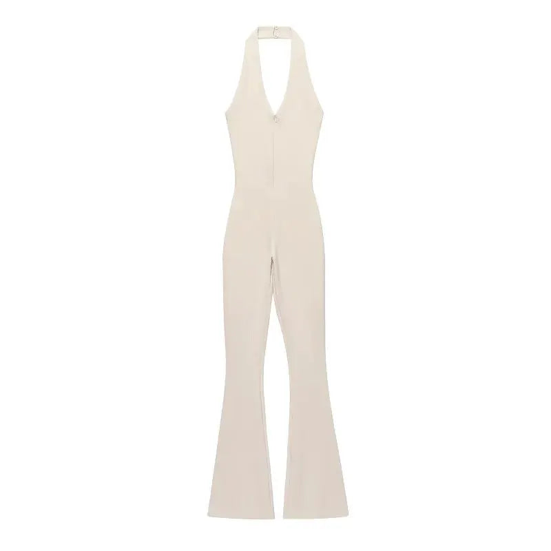 Long beige jumpsuit with halter neck and front zipper; flared legs.