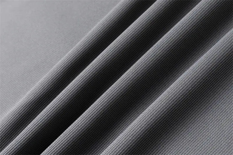 Simples Market men's gray polo shirt fabric close-up showing textured breathable material