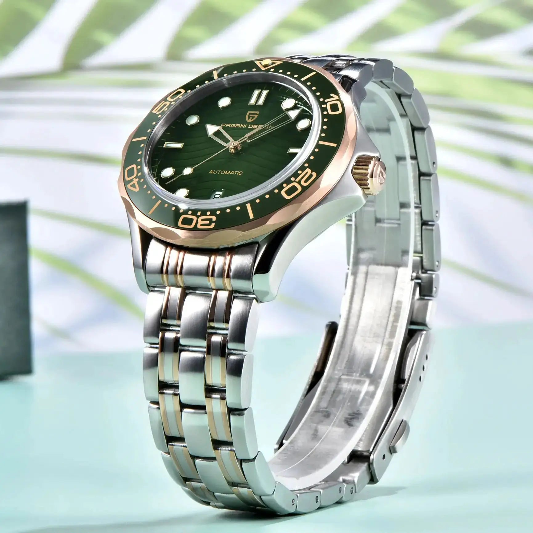 PAGANI DESIGN automatic wristwatch with green dial and gold bezel.