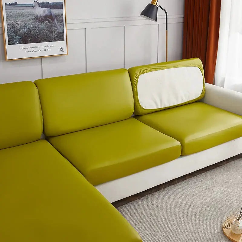 Sofa cover by Simples Market waterproof PU furniture protector for corner sofa in olive green with elastic stretch.