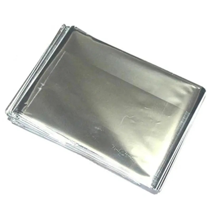 Stack of silver emergency mylar thermal blankets for outdoor survival
