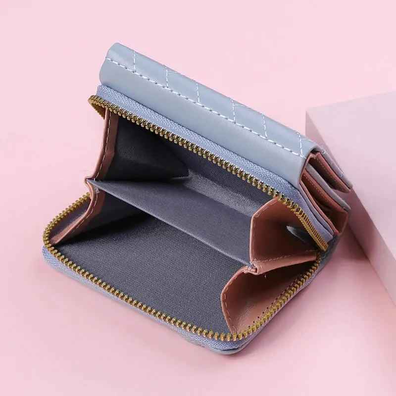 Simples Market women's PU wallet with light blue exterior, gold zipper, brown interior pockets