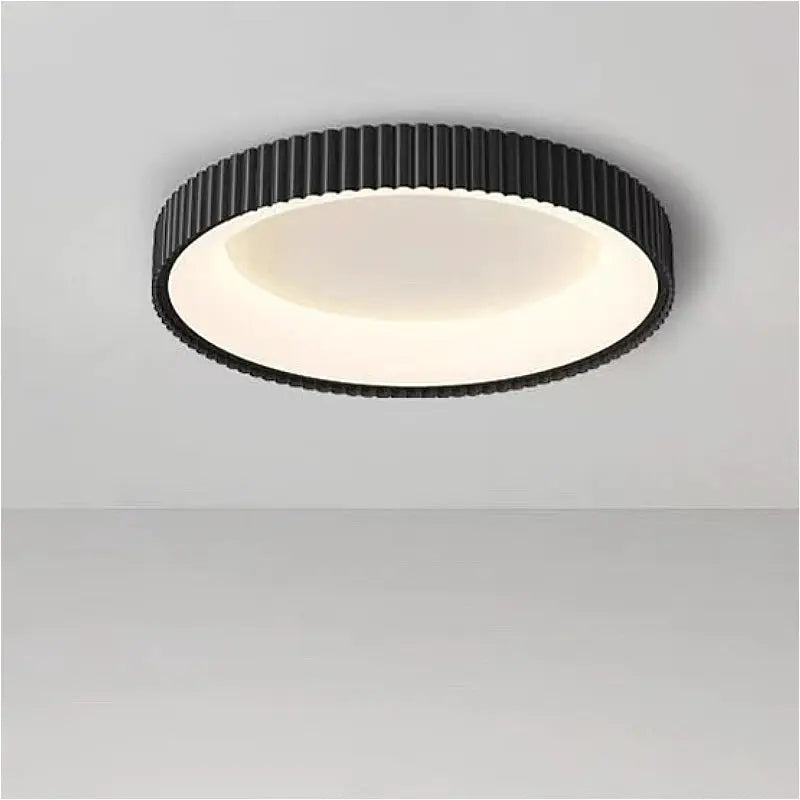 Modern round LED ceiling light with black ribbed metal ring and white diffuser