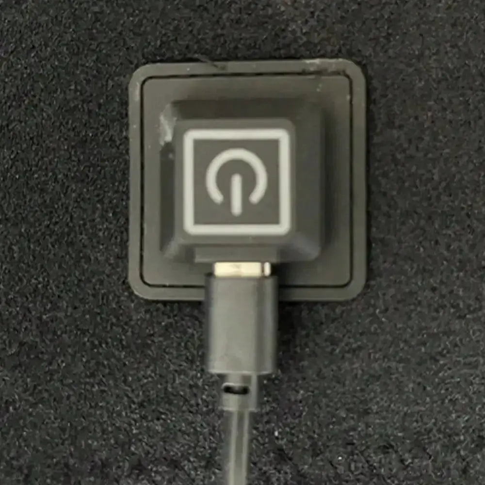 Electric heated shoulder wrap control unit, black plastic housing with power icon