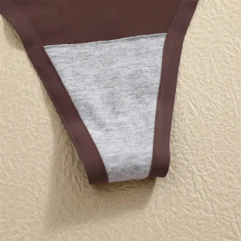Thong underwear by Simples Market: gray ice-silk seamless with brown trim, low-waist T-back