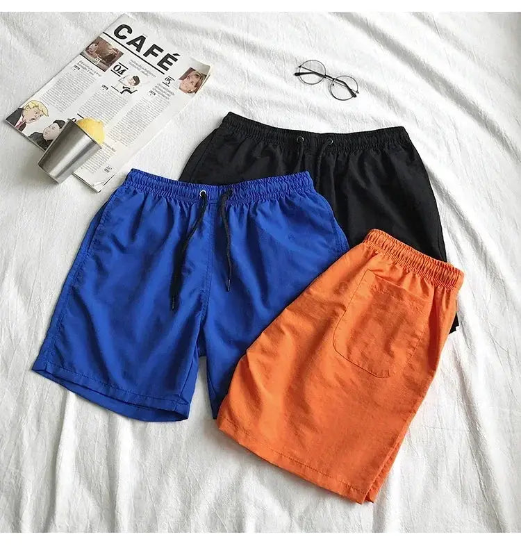 Simples Market men's swim shorts set in blue, black and orange with drawstrings and pocket (3 shorts)