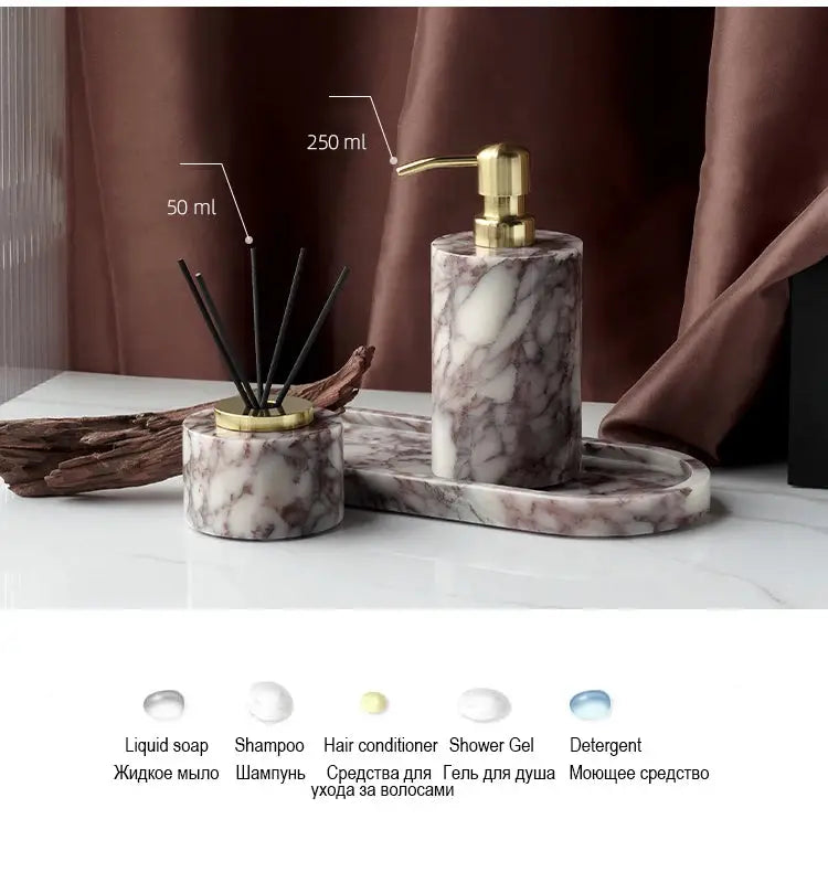 Calacatta Viola marble bathroom set with gold pump; three-piece violet-white soap dispenser, cotton swabs jar, and tray.