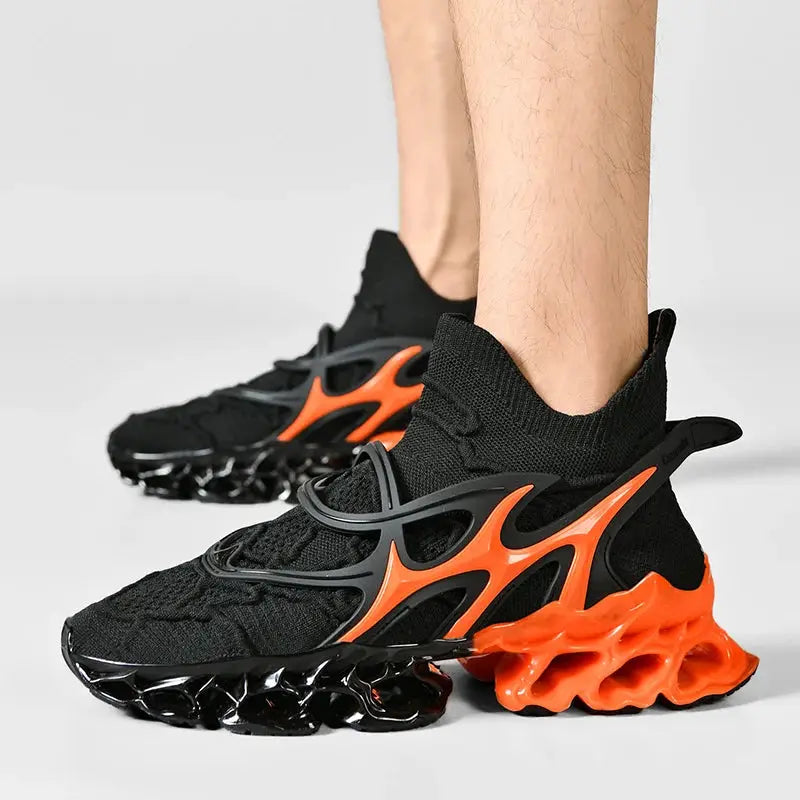 Men's black sneakers with orange lattice outsole and sock-like knit upper