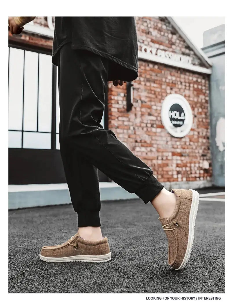 Men casual canvas loafers; tan brown fabric upper with white vulcanized sole