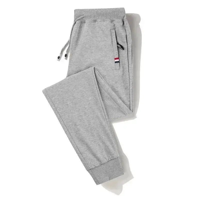 Men's grey cotton jogger pants by Simples Market with elastic waistband and zippered side pocket