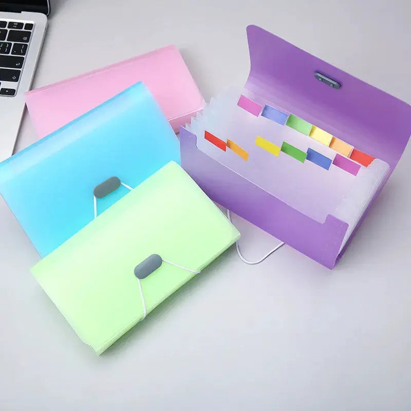 A6 expanding file folders set of four with buckle closures in pink, blue, green, and purple featuring tabbed dividers