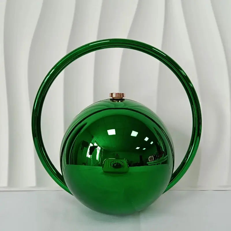 Emerald green acrylic ball-handle evening clutch with circular hoop handle by Simples Market.