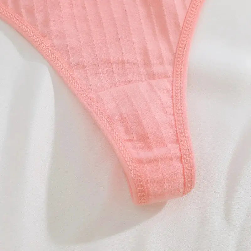 Pink ribbed cotton women's thong underwear, low-rise G-string.