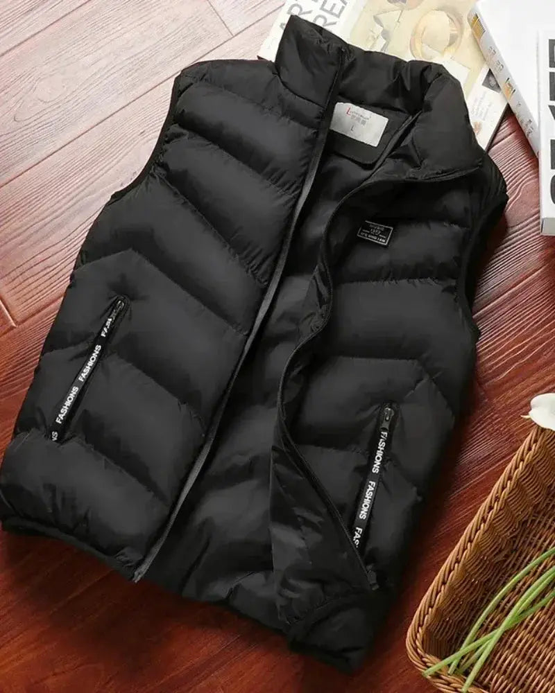 Men's black sleeveless down puffer vest with zip pockets and stand collar.