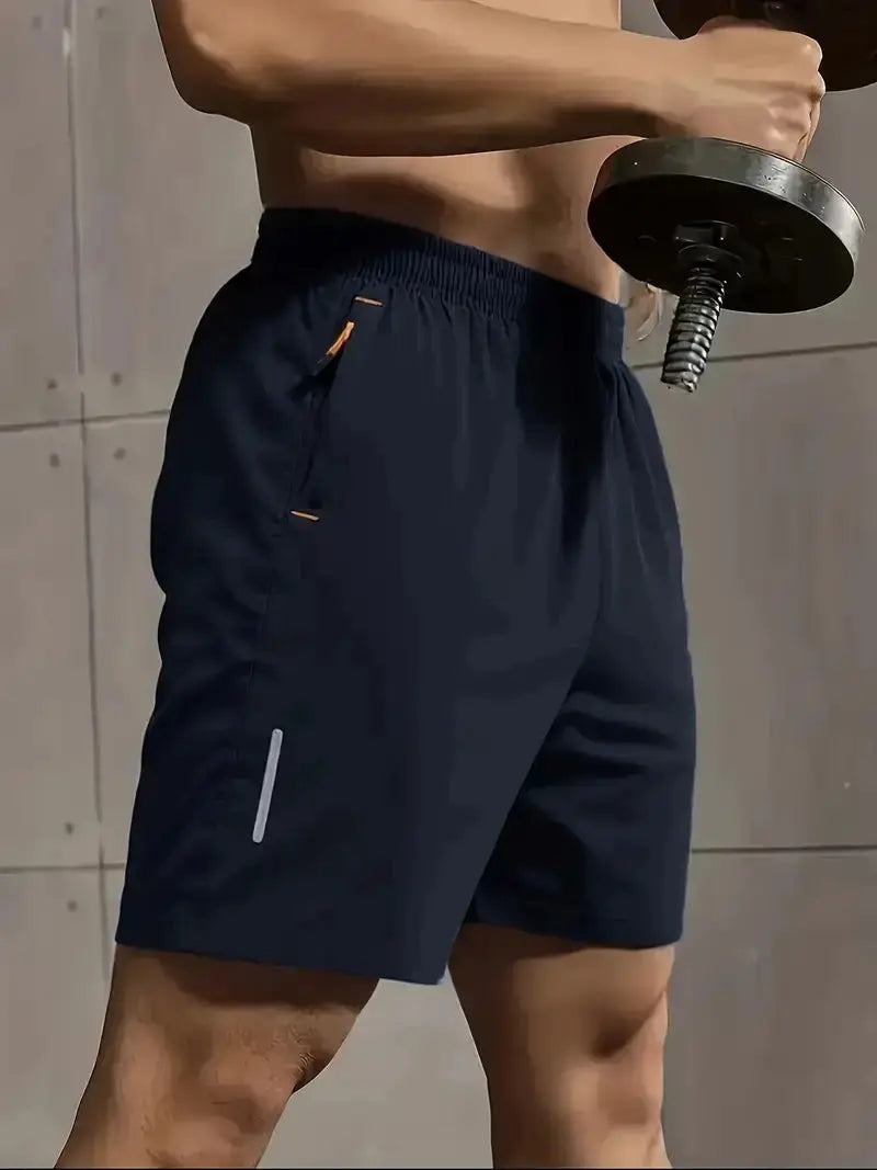 Simples Market men's navy sports shorts with elastic waist, orange drawcord, side pocket, reflective stripe.
