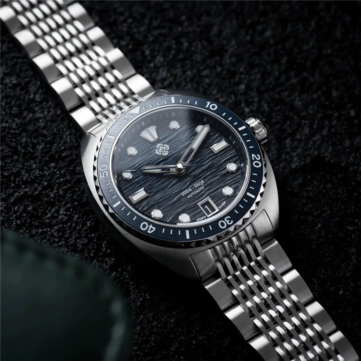 IXDAO IPOSE 2026 men's automatic diving watch with blue Poseidon-pattern dial and stainless steel bracelet