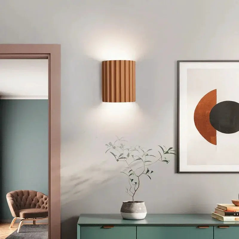 Nordic modern resin wall lamp by Simples Market, brown ribbed cylindrical sconce with warm up and down lighting