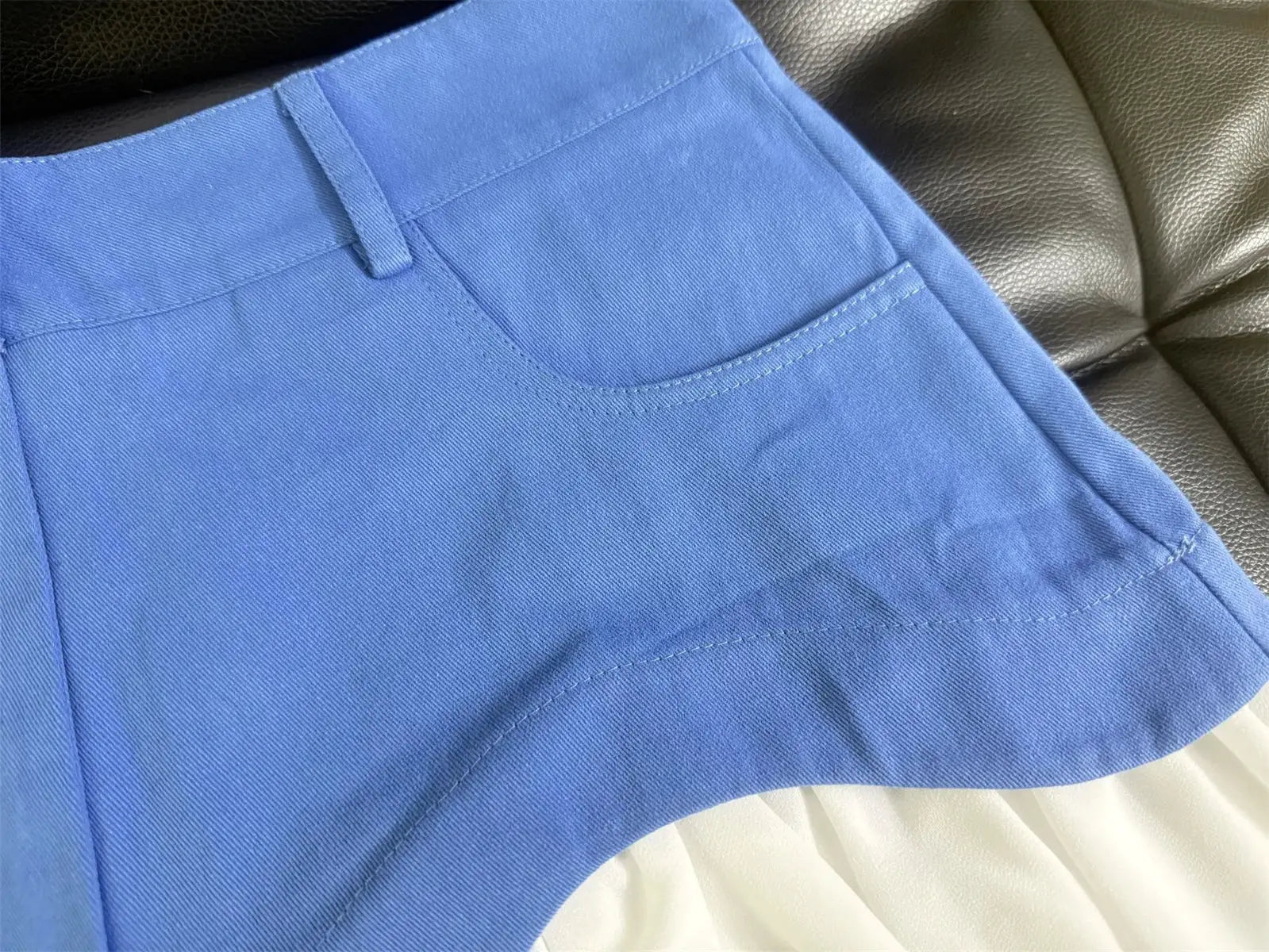Chic blue high-waisted midi skirt with belt loops and curved seam
