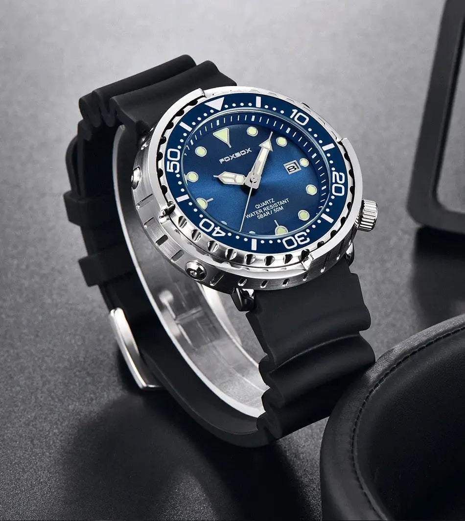 Men's diver watch with blue dial, black rubber strap, date window, luminous markers.