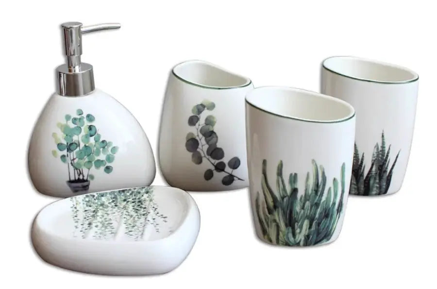 White ceramic bathroom set with green botanical prints; includes soap dispenser, 3 cups, toothbrush holder, and tray.