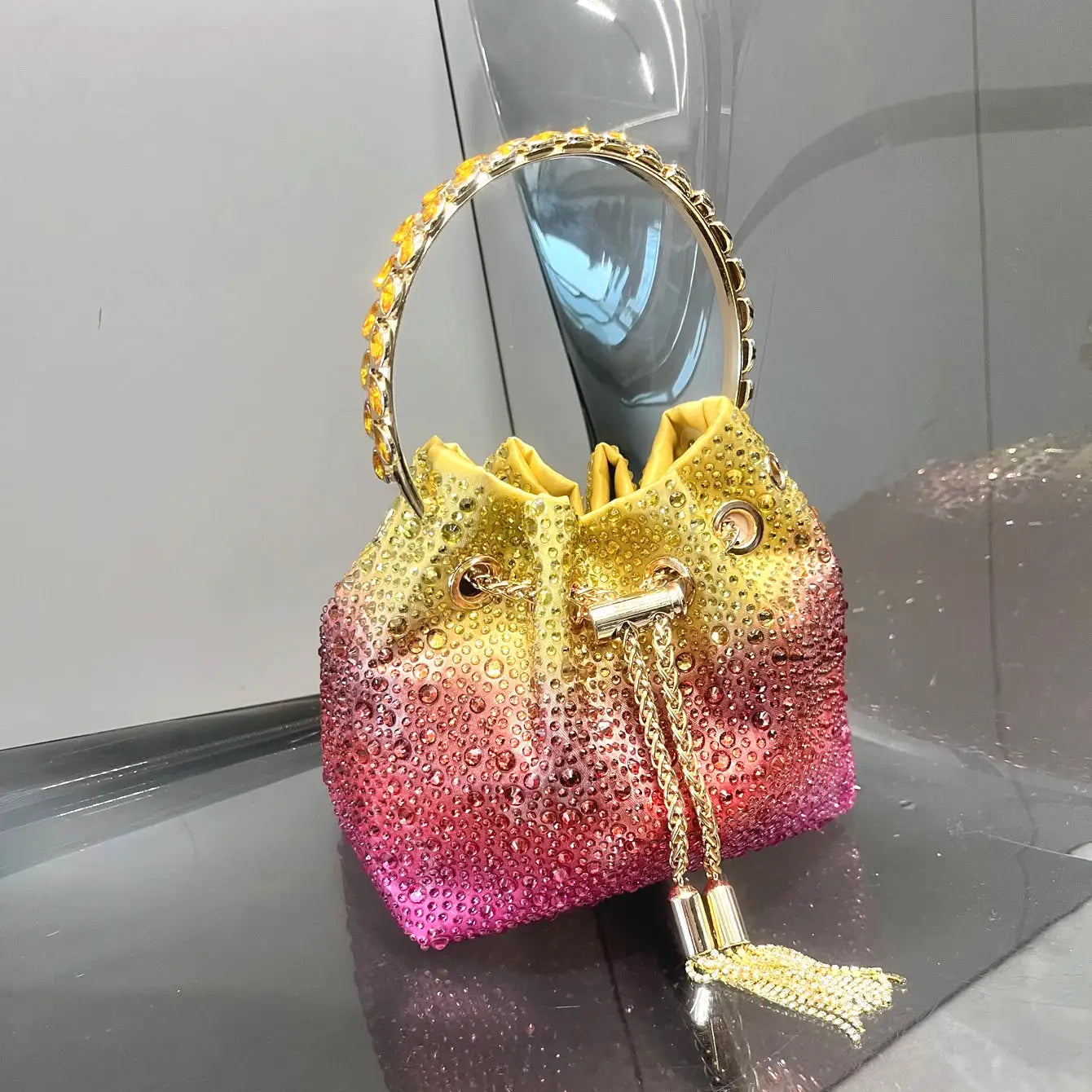 Rhinestone evening clutch with crystal ring handle, gradient yellow–pink bag and tassel chain